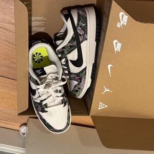 Nike White Sneakers with Black and Green Floral Accents
